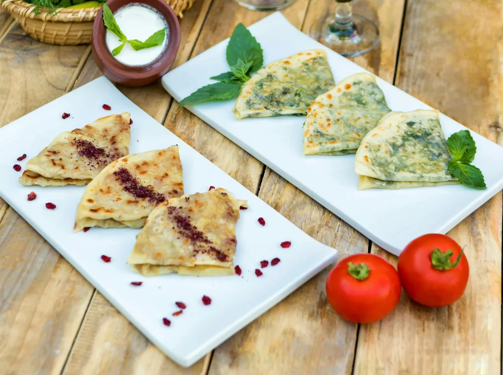 Kutab on plates on a wooden table with decor